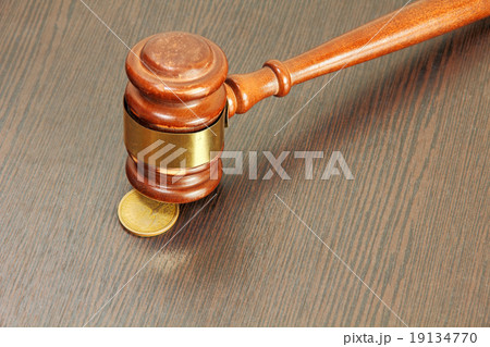 Auction hammer or judge gavel and one dollar coin Auction hammer or judge gavel and one dollar coin 19134770