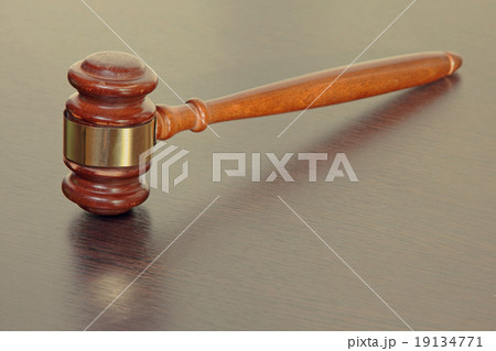 Judge gavel on wooden table in court. Judge gavel on wooden table in court. 19134771