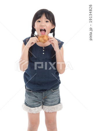 Cute asian girl eating fried chicken 19134826