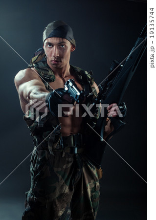 The man in khaki uniforms. 19135744