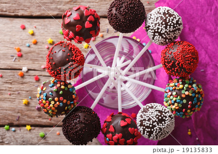 Delicious colorful cake pops in a glass closeup 19135833