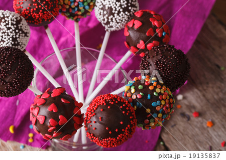 Delicious chocolate cake pops in a glass closeup 19135837