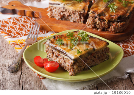 Greek moussaka with eggplant on a table close-up Greek moussaka with eggplant on a table close-up 19136010
