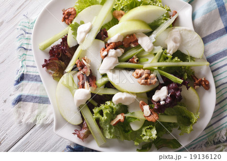Healthy Waldorf Salad close-up on a plate top view 19136120