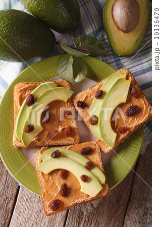 sandwich with peanut butter, avocados closeup 19136470