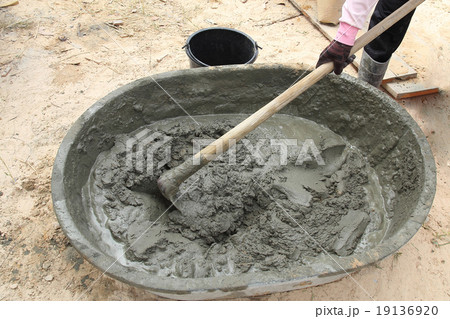 Mixing a cement in salver for construction Mixing a cement in salver for construction 19136920