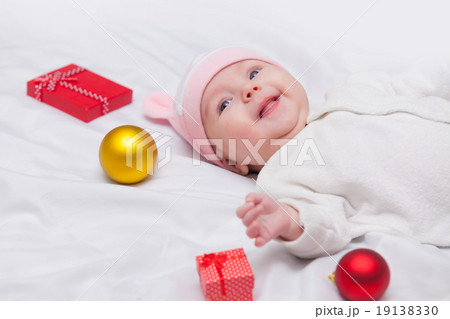 baby with christmas gifts 19138330