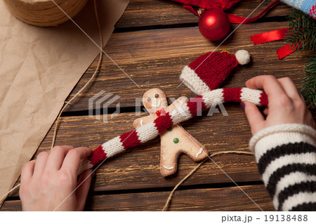Woman wrapping a christmas cookie 19138488