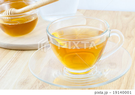 A cup of tea with honey A cup of tea with honey 19140001
