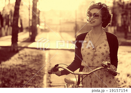 Vintage sepia portrait of a girl hipster concept Vintage sepia portrait of a girl hipster concept 19157154