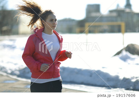 Spring sports running through girl portrait 19157606