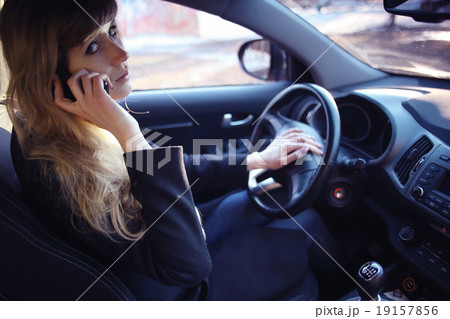 portrait of a girl in a car driver at the wheel 19157856