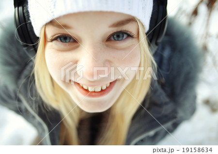 winter portrait of a cute blonde teen 19158634