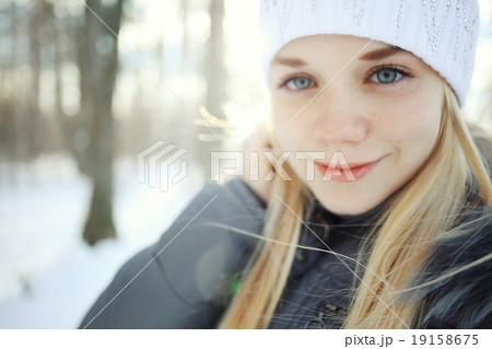 portrait of a young blonde girl in winter forest in the park portrait of a young blonde girl in winter forest in the park 19158675