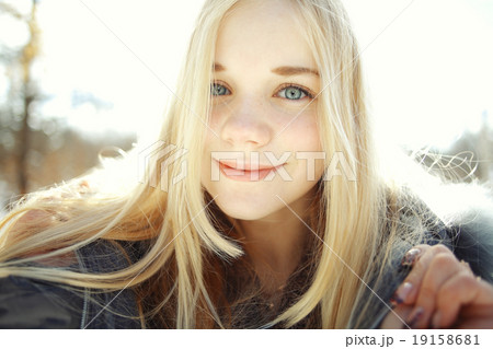 winter portrait of a cute blonde teen 19158681