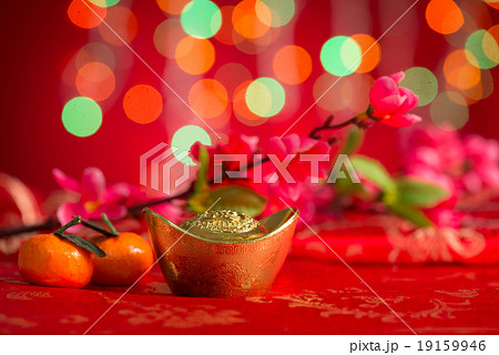 Chinese New Year gold ingots on red background 19159946