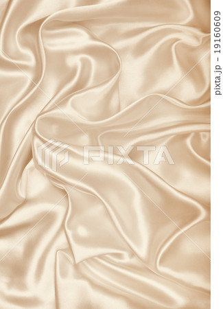 Smooth elegant golden silk as wedding background Smooth elegant golden silk as wedding background 19160609