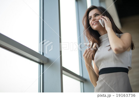 Dark-haired girl in a dress 19163736
