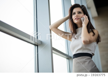 Dark-haired girl in a light dress Dark-haired girl in a light dress 19163775