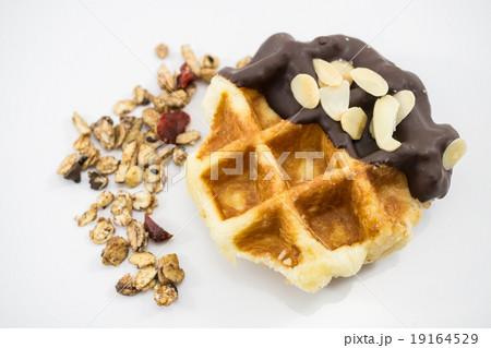 Waffles with chocolate, nut and granola. 19164529