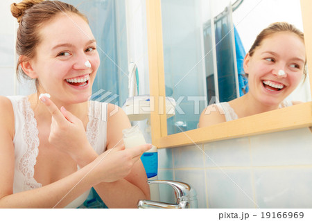 Woman applying moisturizing skin cream. Skincare. Woman applying moisturizing skin cream. Skincare. 19166969
