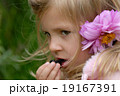 Small girl is eating  blackberry. 19167391