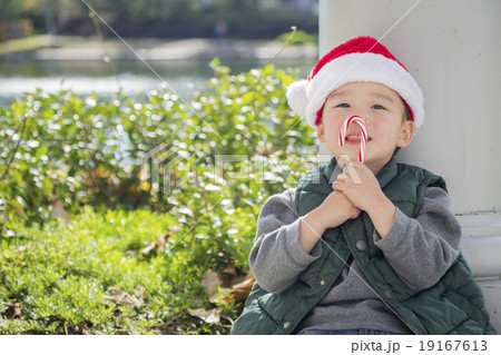 Cute Mixed Race Boy With Santa Hat and Candy Cane Cute Mixed Race Boy With Santa Hat and Candy Cane 19167613
