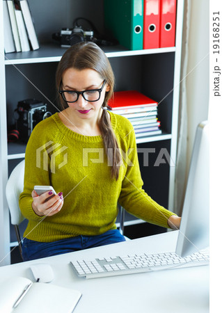 Beautiful young woman working from home 19168251