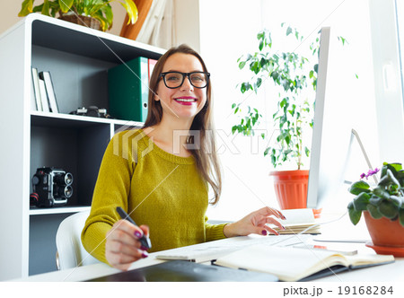 Artist drawing something on graphic tablet at the home office Artist drawing something on graphic tablet at the home office 19168284