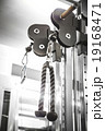Gym interior close up, machinery and weightlifting 19168471