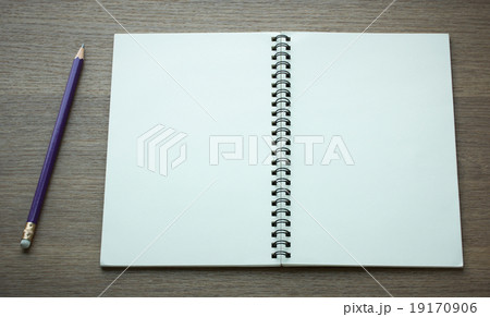 open spiral notebook and pencil 19170906