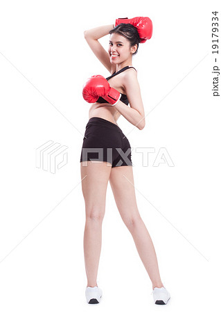 Fitness woman with the red boxing gloves Fitness woman with the red boxing gloves 19179334