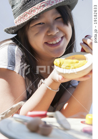Young asian girl playing cook Young asian girl playing cook 19182633