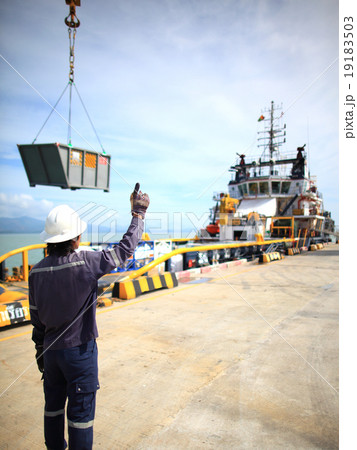 Harbor worker - watching the loading operation 19183503