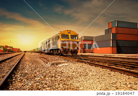 Cargo train platform at sunset with container 19184047