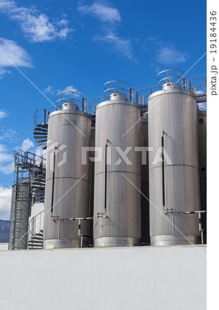 Giant industrial tanks on the bright blue sky 19184436