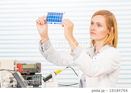 The technician is testing film solar cells 19184704