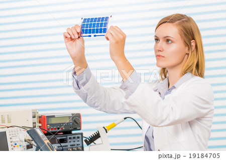 The technician is testing film solar cells 19184705