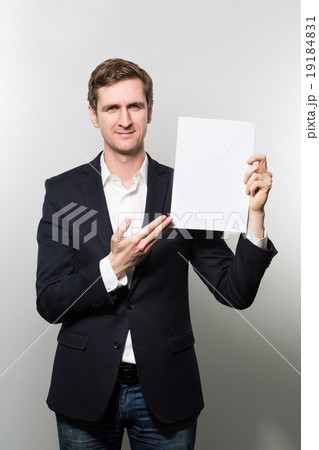 studio shot of businessman with sheet of paper 19184831