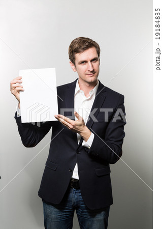 studio shot of businessman with sheet of paper 19184835