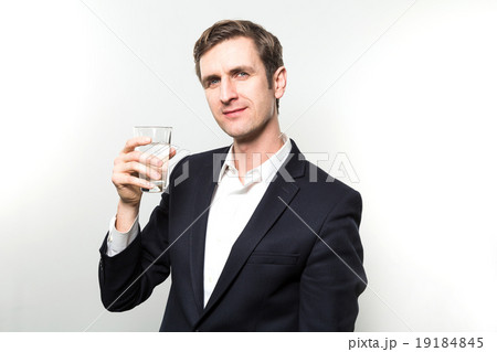 studio shot of businessman with a glas of sparkling water studio shot of businessman with a glas of sparkling water 19184845