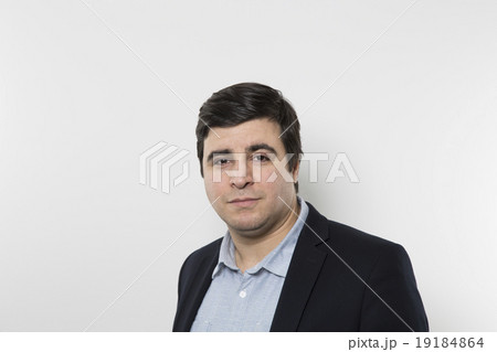 studio shot of happy businessman 19184864