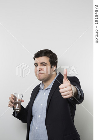 studio shot of happy businessman drinking water studio shot of happy businessman drinking water 19184873