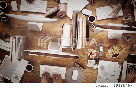 Group of Business People Working on an Office Desk Concept Group of Business People Working on an Office Desk Concept 19189467