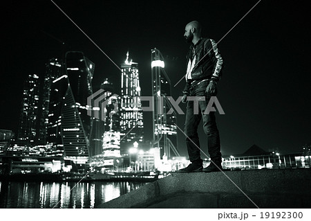 portrait of a man in a night cityscape skyscrapers lights portrait of a man in a night cityscape skyscrapers lights 19192300