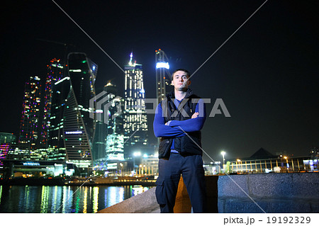portrait of a man in a night cityscape skyscrapers lights portrait of a man in a night cityscape skyscrapers lights 19192329