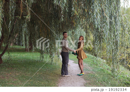loving couple in autumn park sunbeams sunset loving couple in autumn park sunbeams sunset 19192334