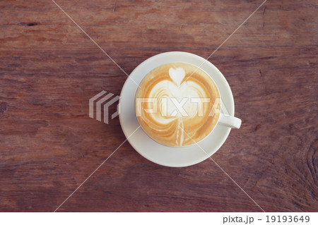 Close up cup of Coffee, latte on the wooden table Close up cup of Coffee, latte on the wooden table 19193649