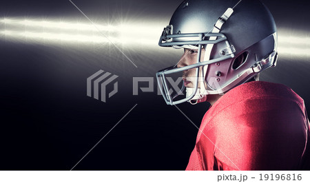 Composite image of side view of serious sportsman standing 19196816