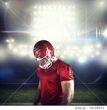 Composite image of american football player looking at camera 19196851